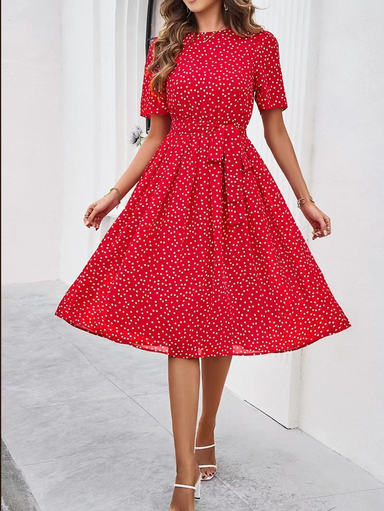 Red polka-dot midi dress with short sleeves and gathered waist, wide flared skirt
