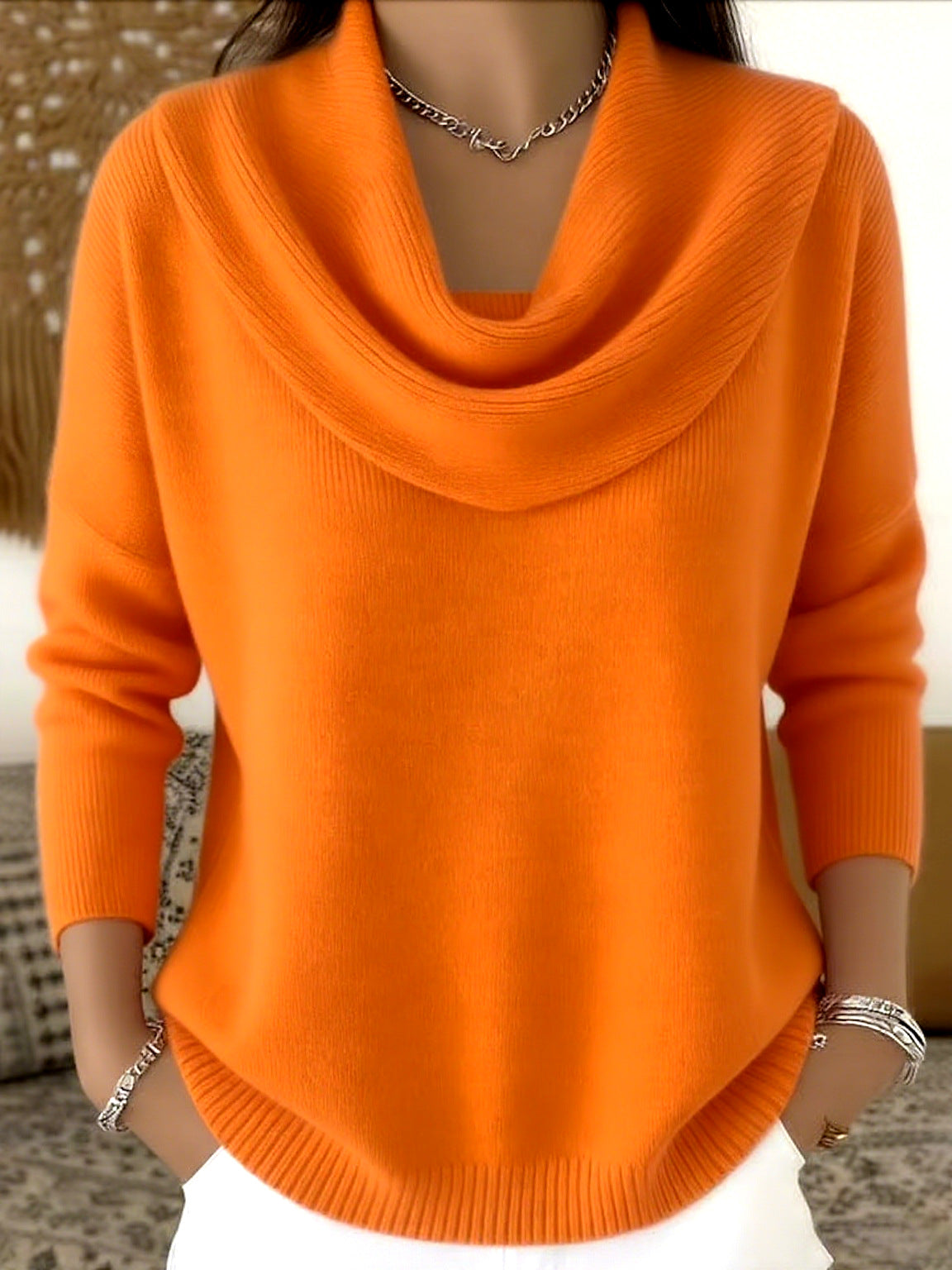 Orange knit jumper with folded collar and long sleeves, ribbed cuffs and hem