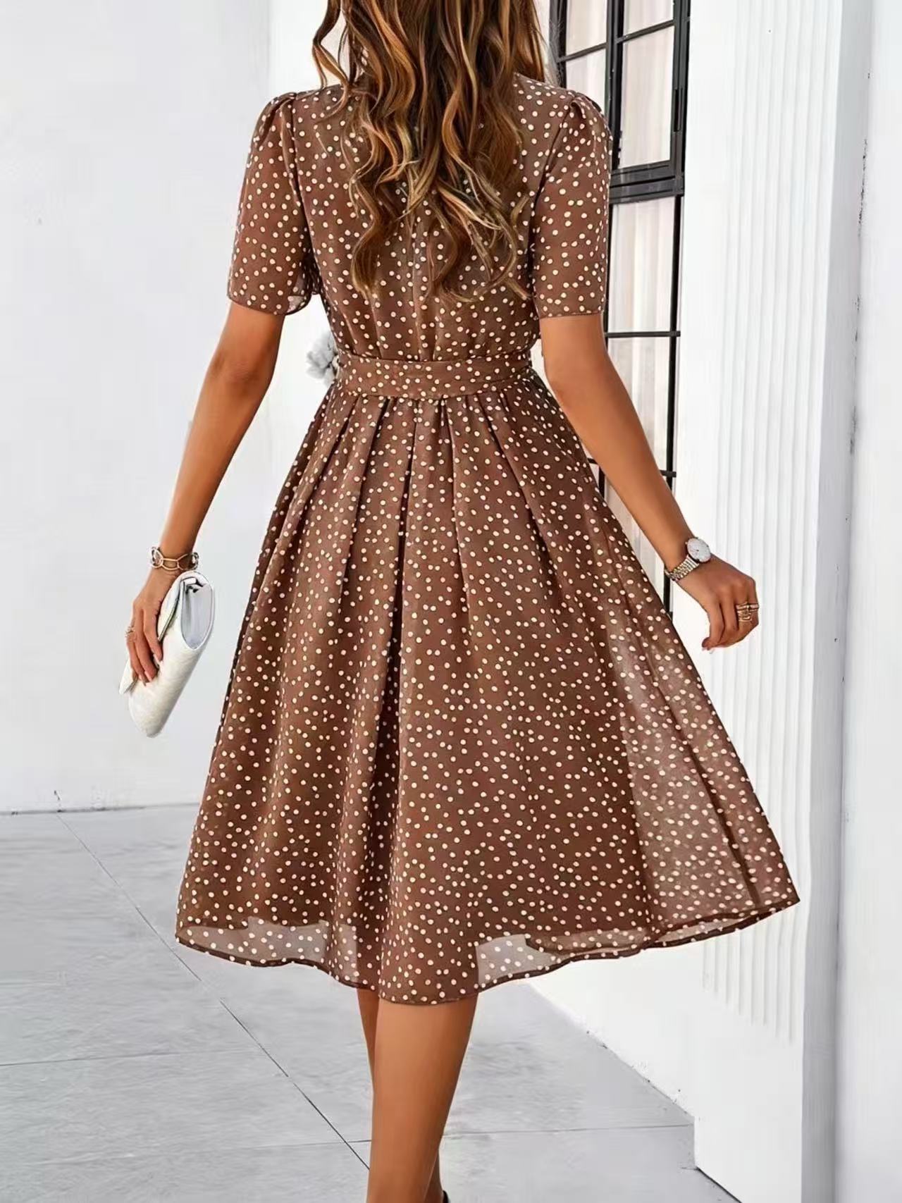 Brown polka-dot dress with short sleeves and tie waist, flared midi skirt (back view)