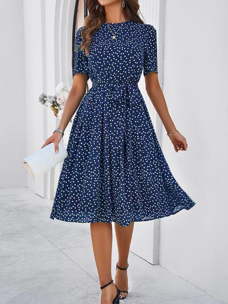 Navy polka-dot lace-up dress with short sleeves and tie waist, flared midi skirt
