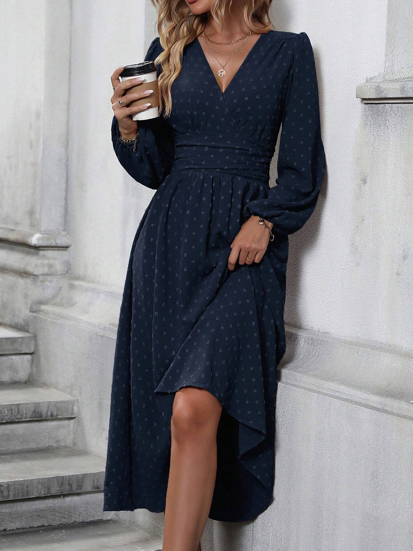 Navy blue dotted pleated lantern-sleeve dress with diagonal V neckline and asym hem