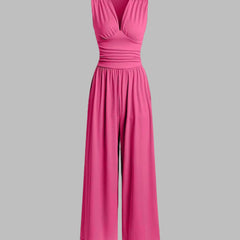 Rose red sleeveless wide-leg jumpsuit with V-neck, ruched bodice and gathered waist.
