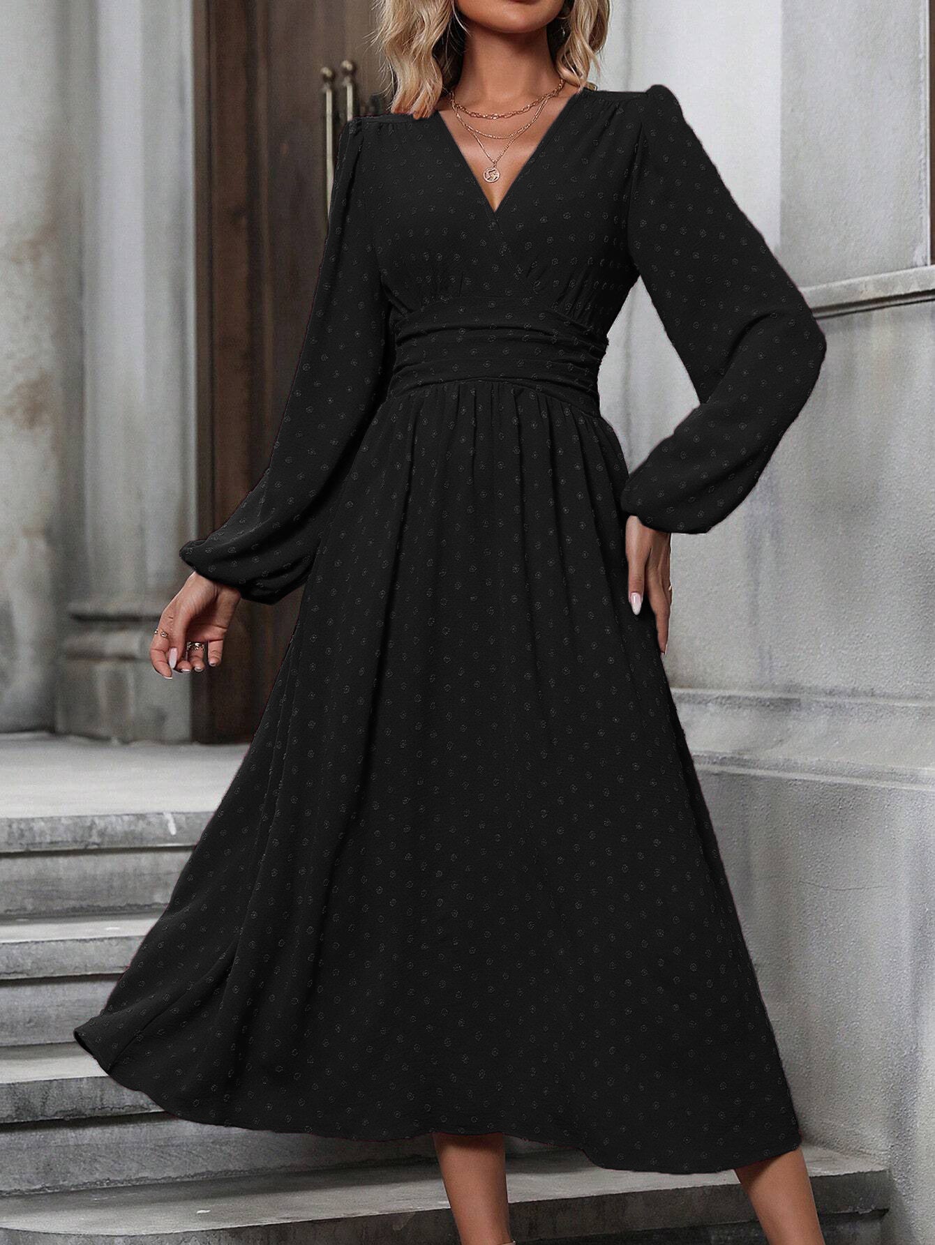 Black dotted pleated dress with diagonal V neckline and long lantern sleeves