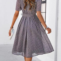 Gray polka-dot midi dress with short sleeves and gathered waist, full twirl skirt