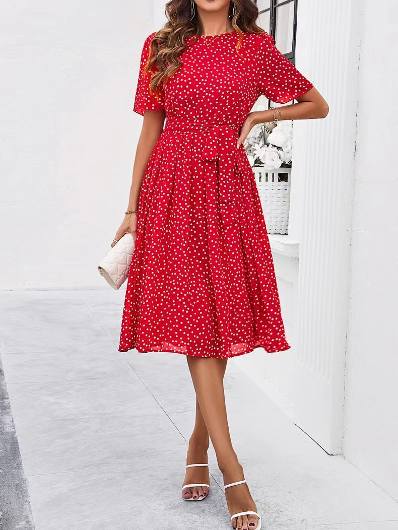 Red polka-dot midi dress with short sleeves and gathered waist, full skirt