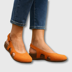 Orange comfort slip-on shoes with cutout sides and low wedge heel