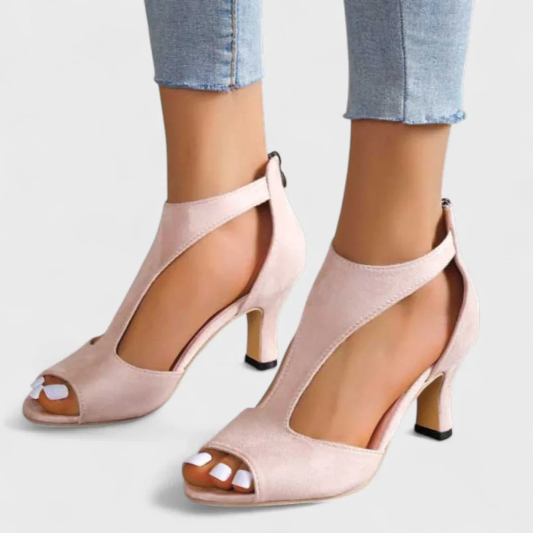 Pink peep-toe heeled sandals with ankle strap and block heel