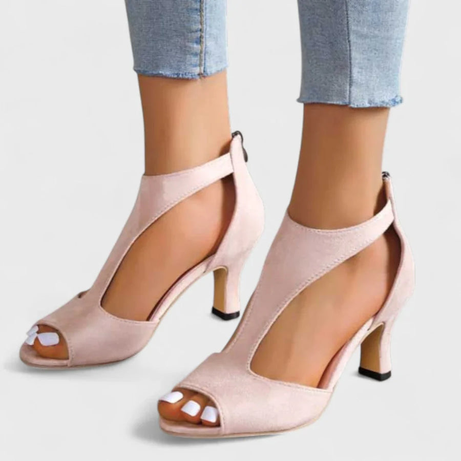Pink peep-toe heeled sandals with ankle strap and block heel