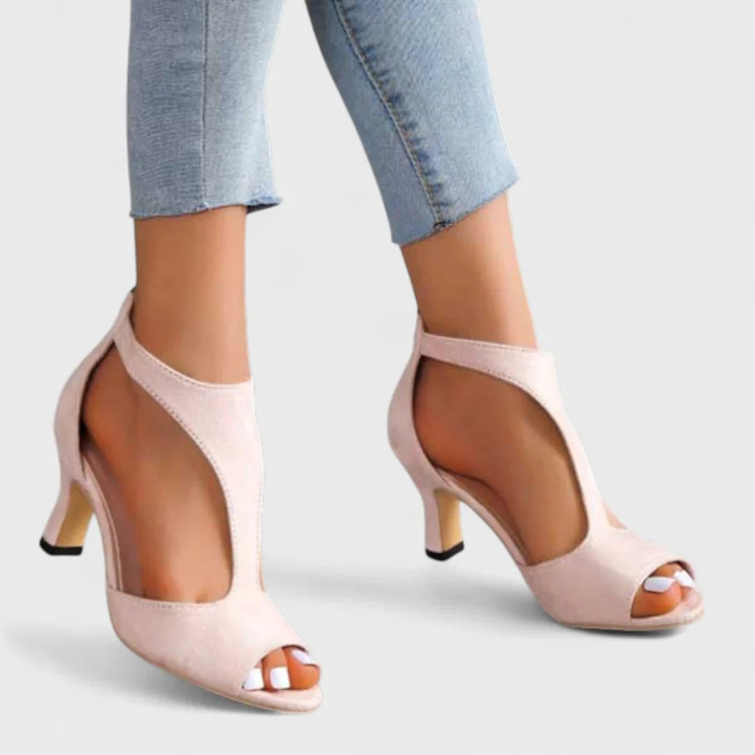 Pink peep-toe heeled sandals with ankle strap and block heel