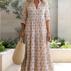 Blush pink boho maxi dress with V-neck, three-quarter sleeves, geometric print