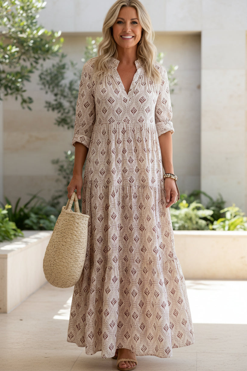 Blush pink boho maxi dress with V-neck, three-quarter sleeves, geometric print