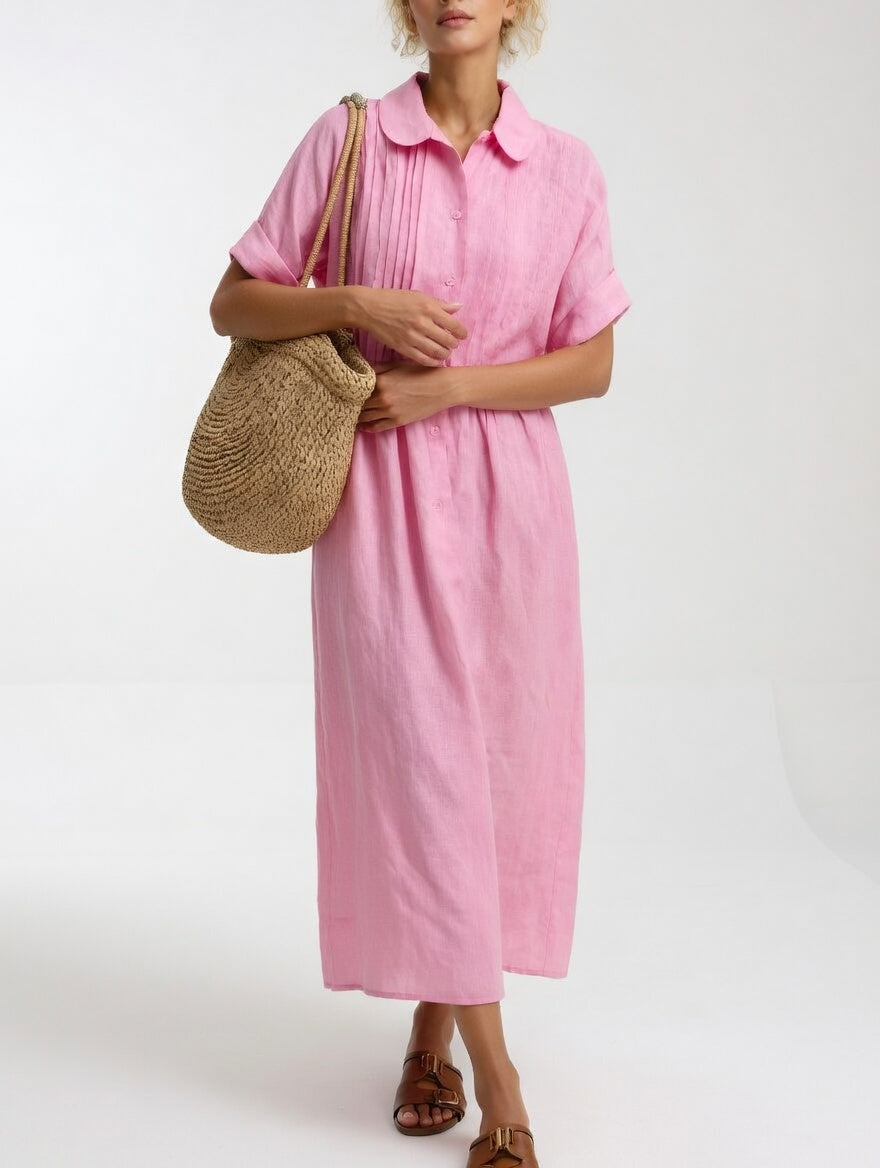 Pink shirt dress with short sleeves, button front, and gathered waist, midi length