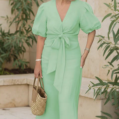 V-neck midi dress in light green with puff sleeves and tied waist.