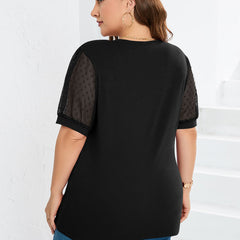 Black sheer-sleeve V-neck top, back view with puff sleeves and relaxed fit.
