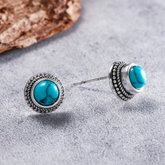 Turquoise stud earrings with silver prong post and engraved bezel
