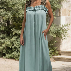 Sage green flowing maxi dress with ruffled neckline and sleeveless gathered bodice.