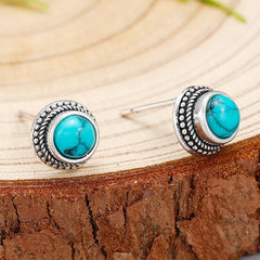 Turquoise stud earrings with silver braided bezel and round cabochon turquoise stones