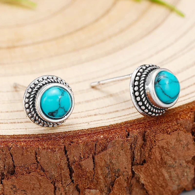 Turquoise stud earrings with silver braided bezel and round cabochon turquoise stones