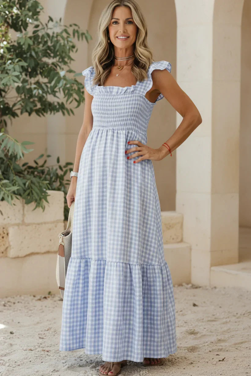 Sky blue gingham ruffle dress with cap sleeves, smocked bodice, tiered skirt