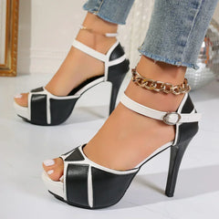 Two-tone white and black high heels with ankle strap and peep-toe