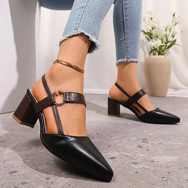 Black ring-strap heels with block heel, pointed toe and side ring buckle