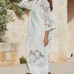 Ivory lace midi dress with V-neck and floral lace paneling, knee-length hem