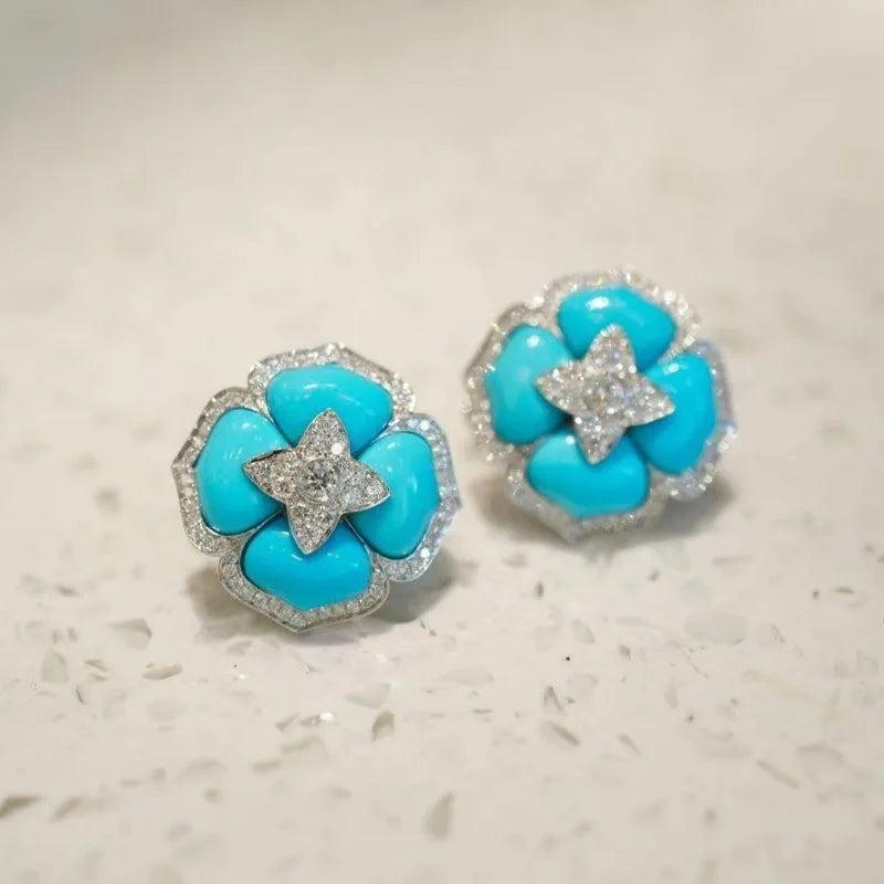 Turquoise flower stud earrings with sparkling crystal star center and silver-tone rim