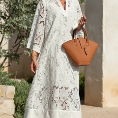 Ivory lace midi dress with V-neck, long sleeves, and cutout floral lace pattern