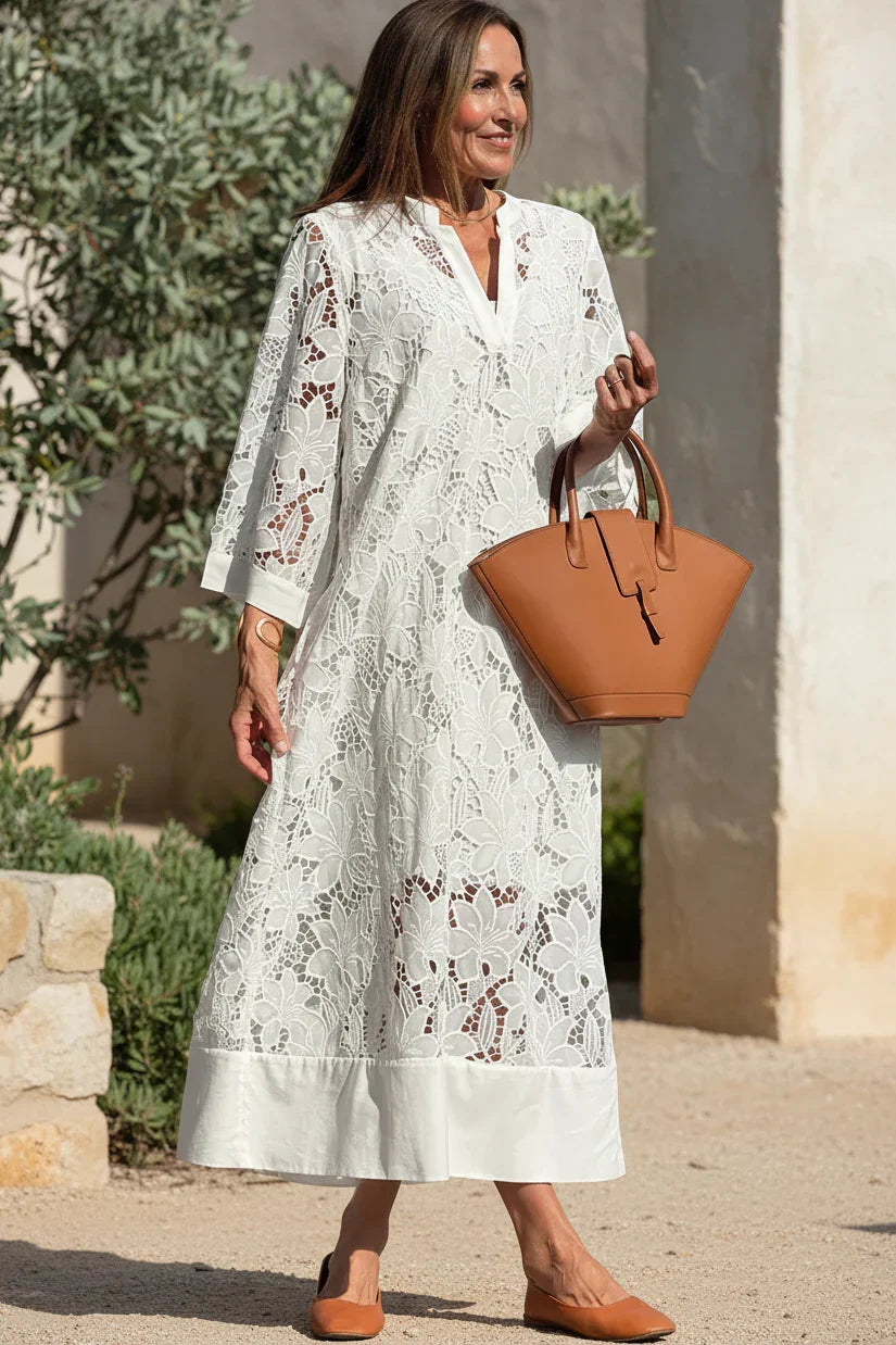 Ivory lace midi dress with V-neck, long sleeves, and cutout floral lace pattern