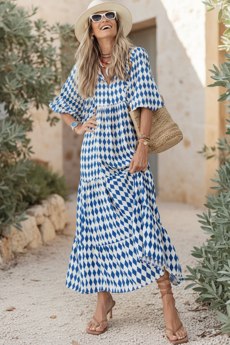 Bohemian dress in blue and white diamond print, short sleeves, tiered maxi hem