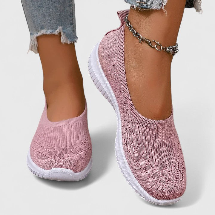 Pink knit slip-on sneakers with white sole and ankle chain detail
