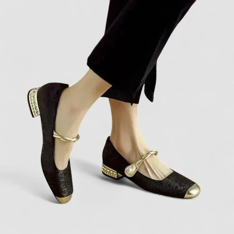 Orthopedic shoes, black textured shoes on model with gold ankle tie and heel cap accents