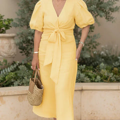 V-neck midi dress in lemon yellow with puff sleeves and tied waist.