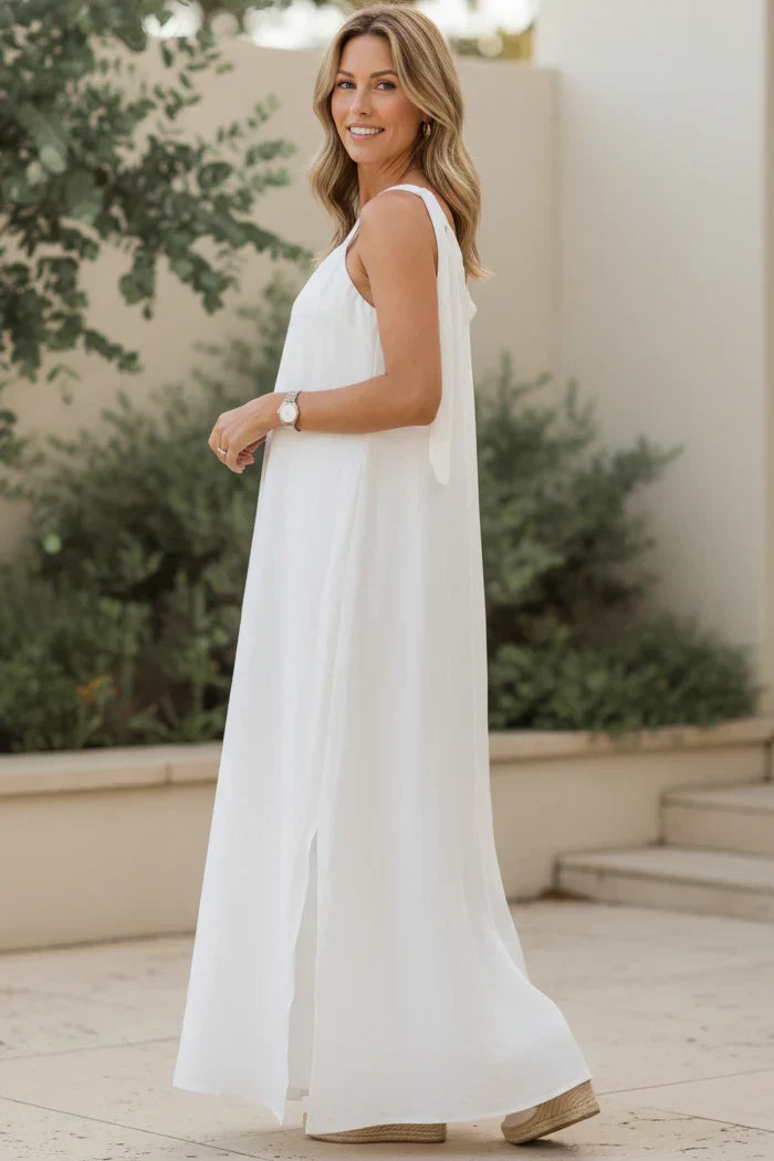 Ivory relaxed maxi dress, sleeveless with thin straps and draped skirt