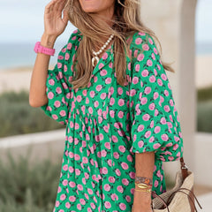 Bohemian dress in pink with green-and-pink floral print, puff sleeves, tiered skirt