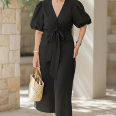 V-neck midi dress in carbon black with puff sleeves and tied waist.