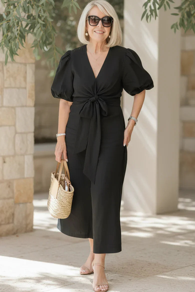 V-neck midi dress in carbon black with puff sleeves and tied waist.