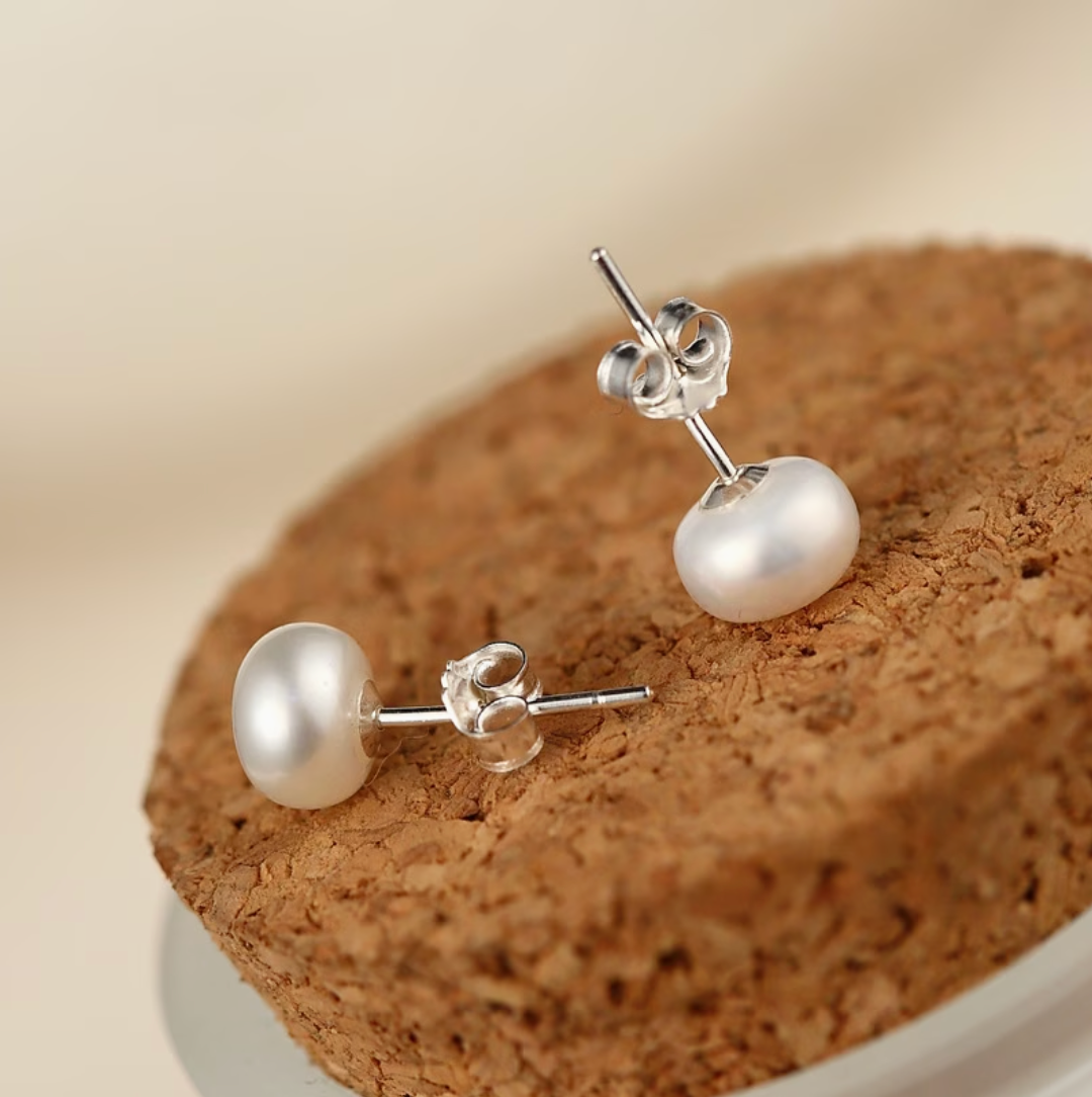 Pearl stud earrings with round white pearl and silver-tone butterfly backs