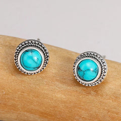 Turquoise cabochon stud earrings with textured silver outer ring