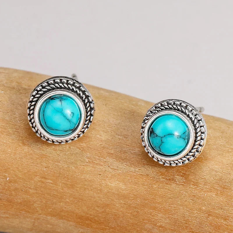 Turquoise cabochon stud earrings with textured silver outer ring