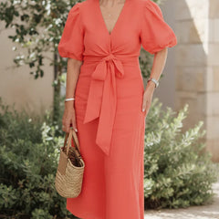V-neck midi dress in vivid red with puff sleeves and tied waist.