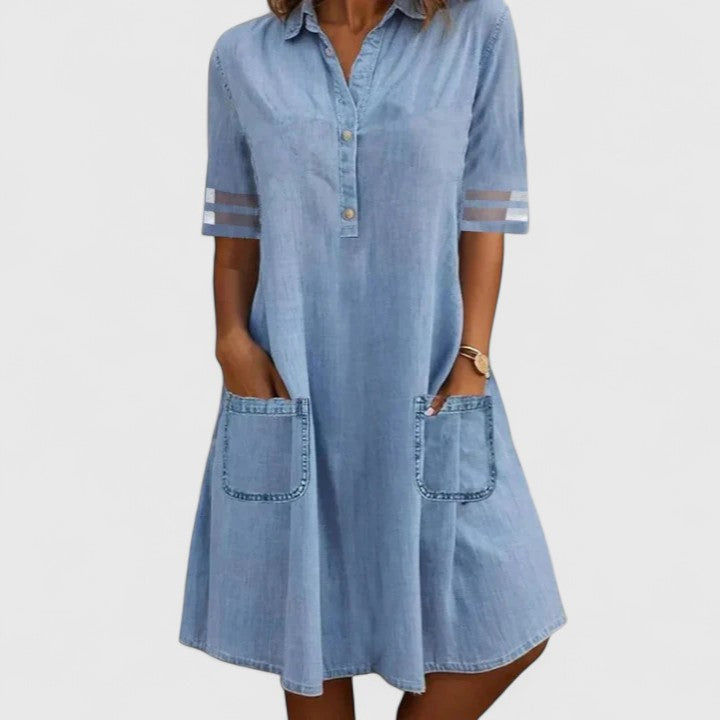 Light blue denim shirt dress with collar, button front, rolled sleeves, and front patch pockets