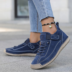 Navy blue comfort sneakers with lace-up front and side strap detailing