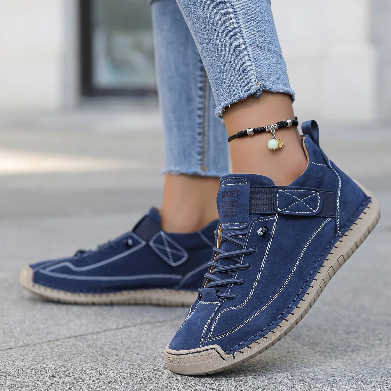 Navy blue comfort sneakers with lace-up front and side strap detailing