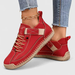 Red comfort sneakers with lace-up front, stitch trim, and ankle strap