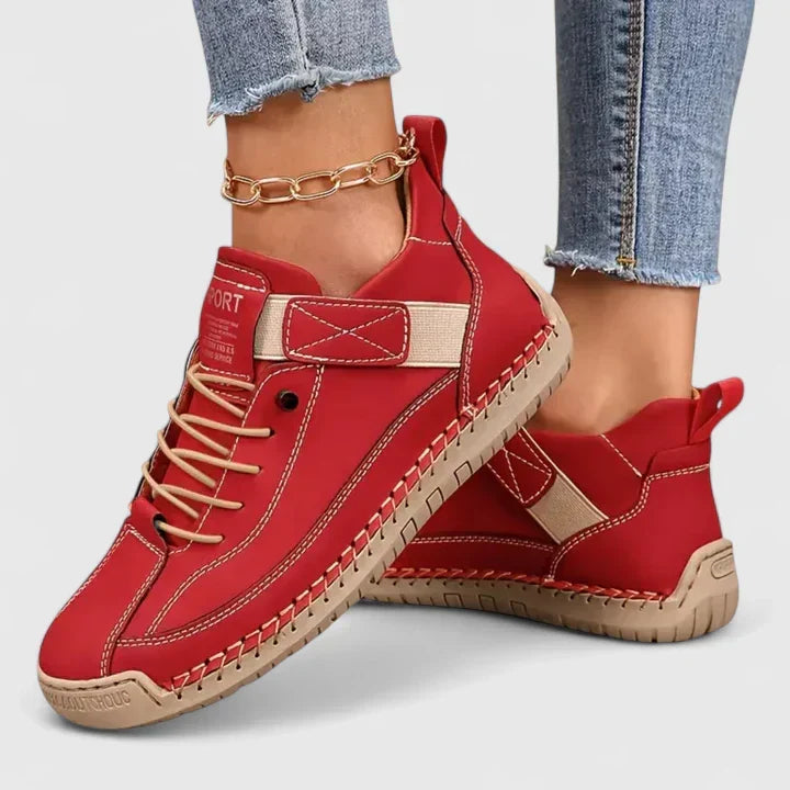 Red comfort sneakers with lace-up front, stitch trim, and ankle strap