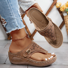 Brown Jean sandals with perforated upper and adjustable strap with gold-tone buckle.