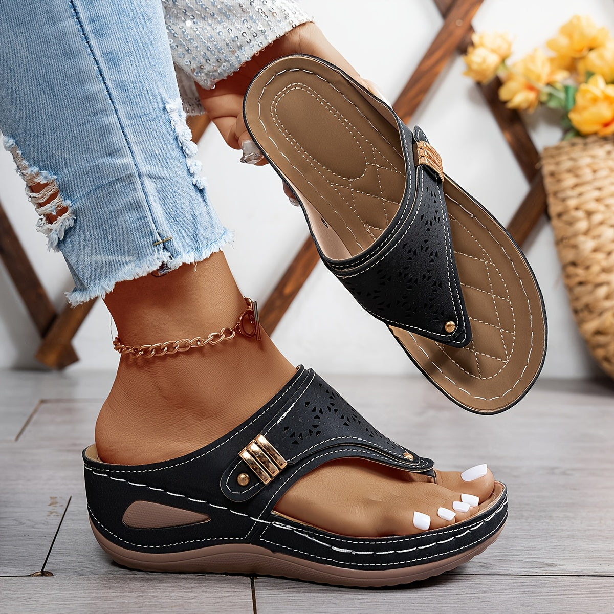 Navy Jean sandals with perforated leather-look panels and gold-tone buckle strap.