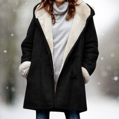 Black shearling coat with light shearling collar trim, toggle closures, long sleeves