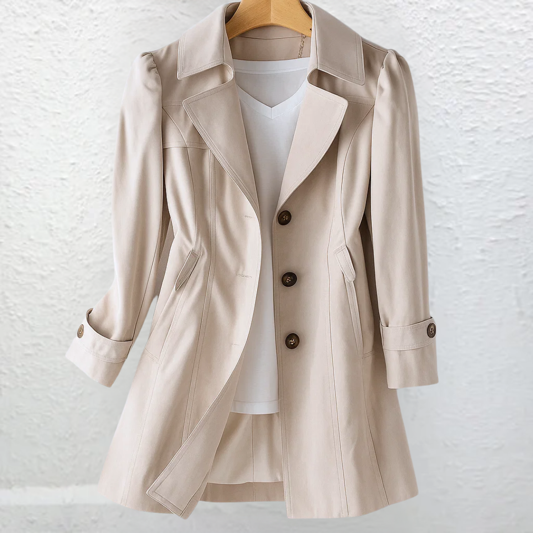 Beige trench-style coat on hanger, showing button front and cuff tabs